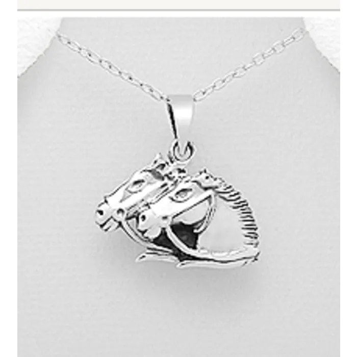 2 paardenhoofden van zilver