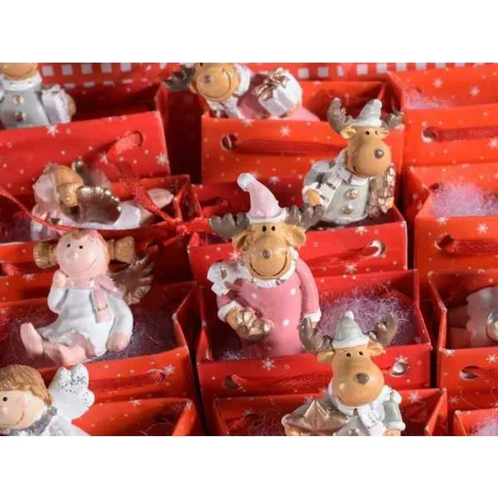 Kerstfiguur in cadeaudoosje met kerstkaartje