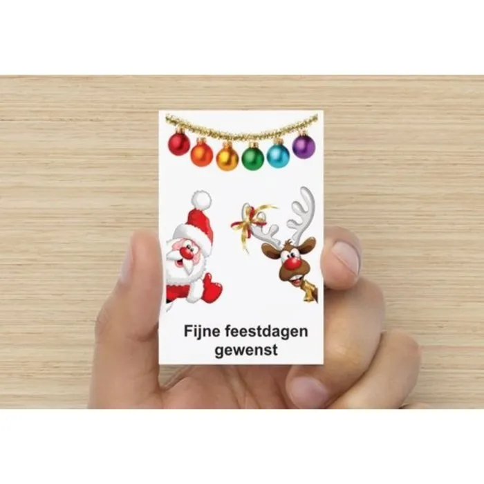 Kerstfiguur in cadeaudoosje met kerstkaartje