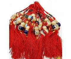 gelukspoppetje met kwastje