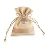 Jute zakje met metalen levensboomhanger